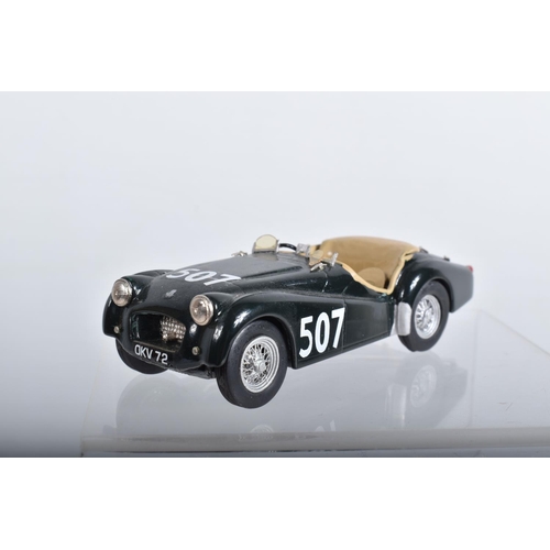 56 - FOUR CONSTRUCTED K & R REPLICAS TRIUMPH TR2 SPORTS CAR MODEL KITS, all 1/43 white metal kits that ha... 