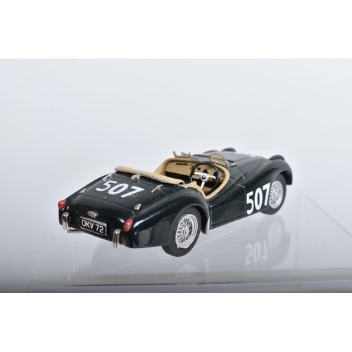 56 - FOUR CONSTRUCTED K & R REPLICAS TRIUMPH TR2 SPORTS CAR MODEL KITS, all 1/43 white metal kits that ha... 