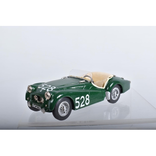 56 - FOUR CONSTRUCTED K & R REPLICAS TRIUMPH TR2 SPORTS CAR MODEL KITS, all 1/43 white metal kits that ha... 