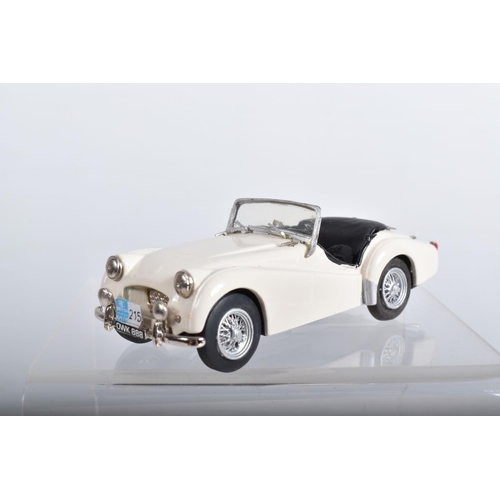 56 - FOUR CONSTRUCTED K & R REPLICAS TRIUMPH TR2 SPORTS CAR MODEL KITS, all 1/43 white metal kits that ha... 