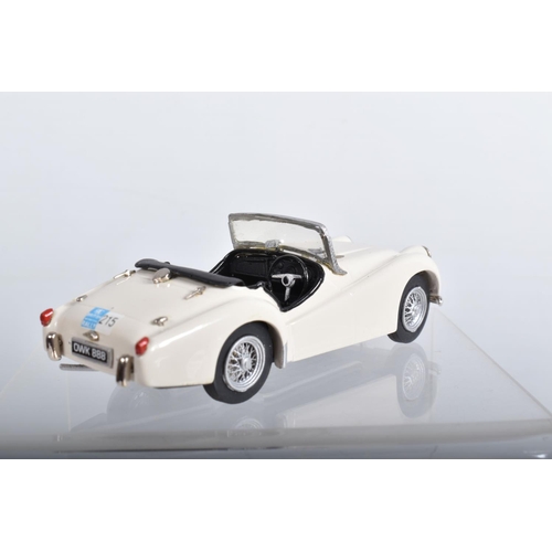 56 - FOUR CONSTRUCTED K & R REPLICAS TRIUMPH TR2 SPORTS CAR MODEL KITS, all 1/43 white metal kits that ha... 