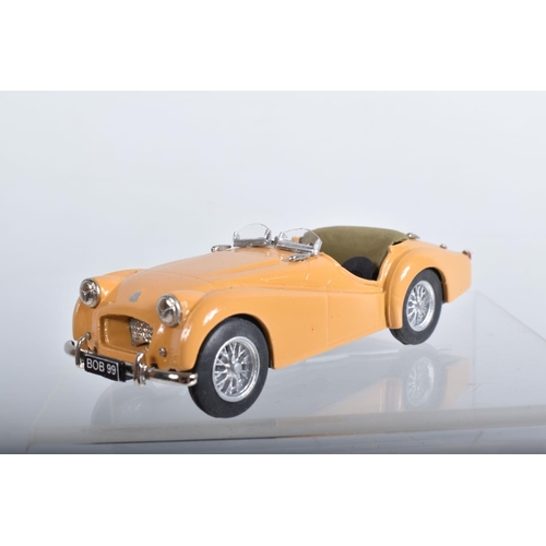 56 - FOUR CONSTRUCTED K & R REPLICAS TRIUMPH TR2 SPORTS CAR MODEL KITS, all 1/43 white metal kits that ha... 