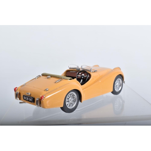 56 - FOUR CONSTRUCTED K & R REPLICAS TRIUMPH TR2 SPORTS CAR MODEL KITS, all 1/43 white metal kits that ha... 