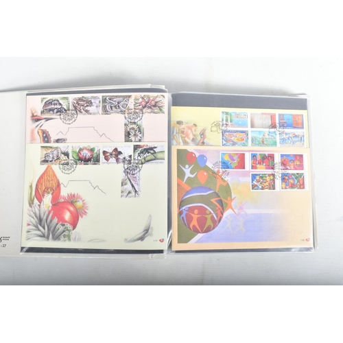 408 - BANANA BOX WITH COLLECTION OF WORLDWIDE FDCS IN ALBUMS, OFTEN ANIMAL THEMATICS, ALSO SOME FRAMED ITE... 