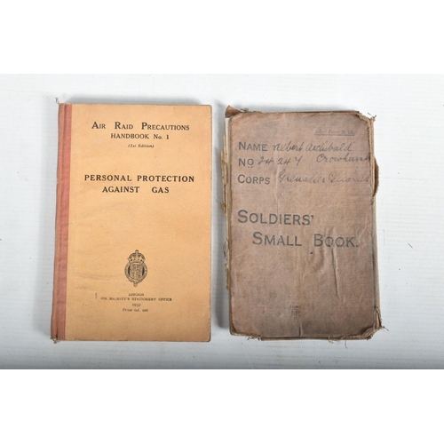 437 - WWI AND WWII MILITARY RELATED ITEMS, to include a WWI soldiers small book, a 1940 gas mask, an ARP b... 