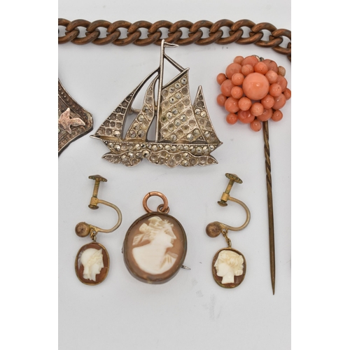 56 - A SELECTION OF JEWELLERY, to include a heart shape amber stickpin, a marcasite boat brooch, a cluste... 