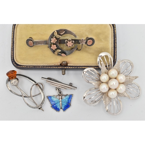 67 - FOUR BROOCHES, to include a late Victorian silver brooch designed as a bar brooch with central cresc... 