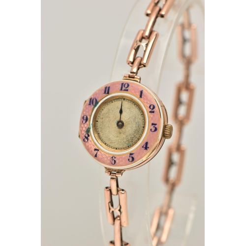 95 - A LADIES 9CT GOLD AND PINK GUILLOCHE ENAMEL WRISTWATCH, manual wind, half hunter style, round dial w... 