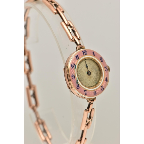 95 - A LADIES 9CT GOLD AND PINK GUILLOCHE ENAMEL WRISTWATCH, manual wind, half hunter style, round dial w... 