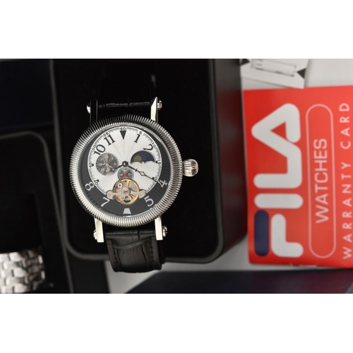 109 - SEVEN BOXED WRISTWATCHES, to include three Fila chronograph watches, two with titanium cases, one st... 