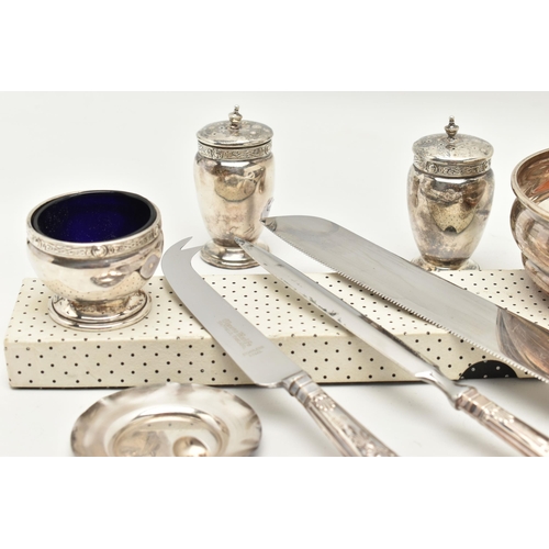 131 - A BOX OF SILVER ITEMS, to include a pair of pepperettes, polished urn form with Celtic pattern colla... 