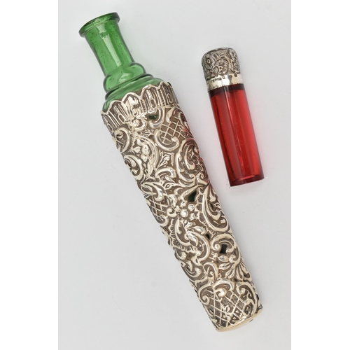 146 - TWO SCENT BOTTLES, the first a green tapering glass bottle with embossed scrolling cover and engrave... 