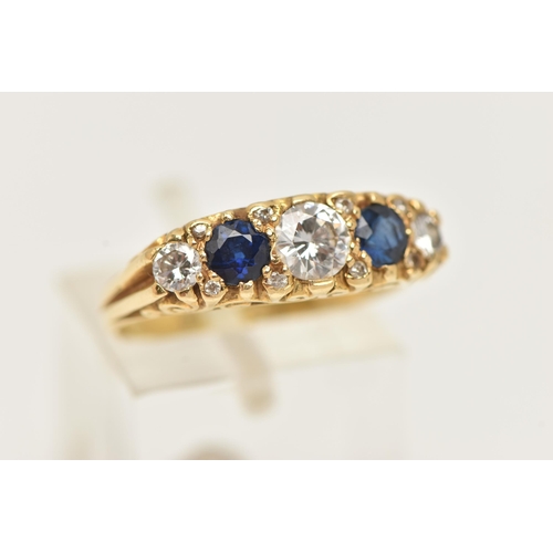 168 - AN 18CT GOLD DIAMOND AND SAPPHIRE RING, set with three graduating round brilliant cut diamonds, meas... 