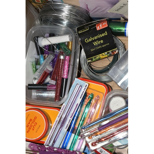 324 - FOUR BOXES OF ASSORTED ARTS AND CRAFTS SUPPLIES to include a rack of patterned scissors, a tub of be... 