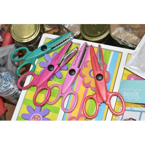 324 - FOUR BOXES OF ASSORTED ARTS AND CRAFTS SUPPLIES to include a rack of patterned scissors, a tub of be... 