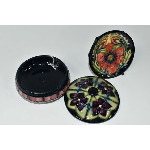 348 - TWO PIECES OF MOORCROFT POTTERY, comprising a Violet pattern covered bowl, tube lined with stylised ... 