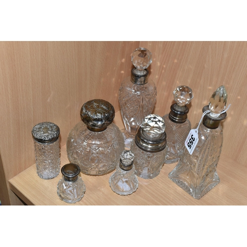 355 - EIGHT GLASS SCENT BOTTLES, with silver collars or covers, comprising a square based scent bottle, co... 