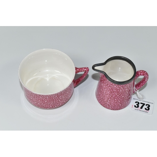 373 - A ROYAL DOULTON PINK 'SHAGREEN' CREAM JUG AND TEACUP, green printed backstamp, with pattern name and... 