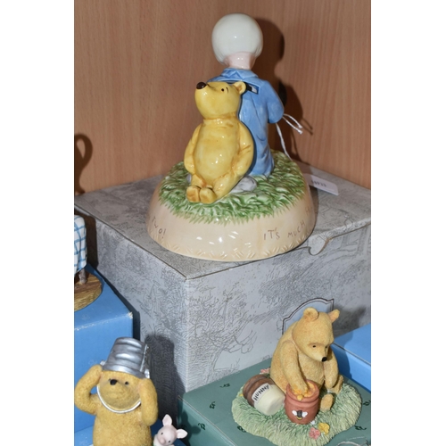 375 - A COLLECTION OF BOXED WINNIE THE POOH COLLECTABLES, comprising a Pooh and Christopher Robin ceramic ... 