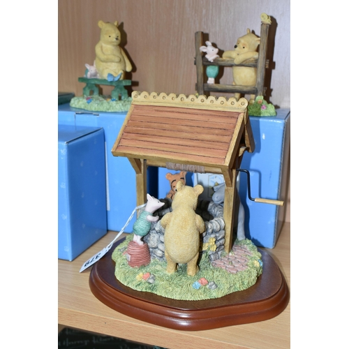 379 - A COLLECTION OF BOXED WINNIE THE POOH COLLECTABLES, comprising Border Fine Arts 'Classic Pooh': Pooh... 