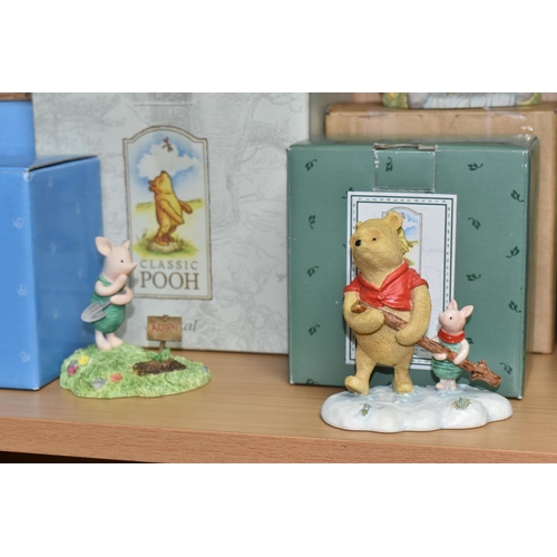 379 - A COLLECTION OF BOXED WINNIE THE POOH COLLECTABLES, comprising Border Fine Arts 'Classic Pooh': Pooh... 