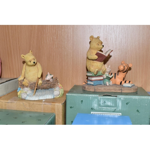 379 - A COLLECTION OF BOXED WINNIE THE POOH COLLECTABLES, comprising Border Fine Arts 'Classic Pooh': Pooh... 