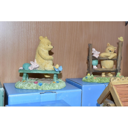 379 - A COLLECTION OF BOXED WINNIE THE POOH COLLECTABLES, comprising Border Fine Arts 'Classic Pooh': Pooh... 