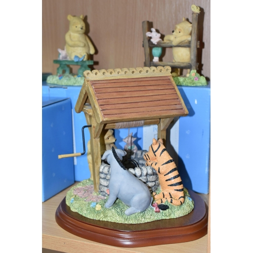 379 - A COLLECTION OF BOXED WINNIE THE POOH COLLECTABLES, comprising Border Fine Arts 'Classic Pooh': Pooh... 