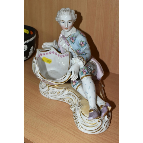 390 - A PAIR OF CONTINENTAL PORCELAIN FIGURAL BON BON DISHES, modelled with a recumbent young gentleman an... 