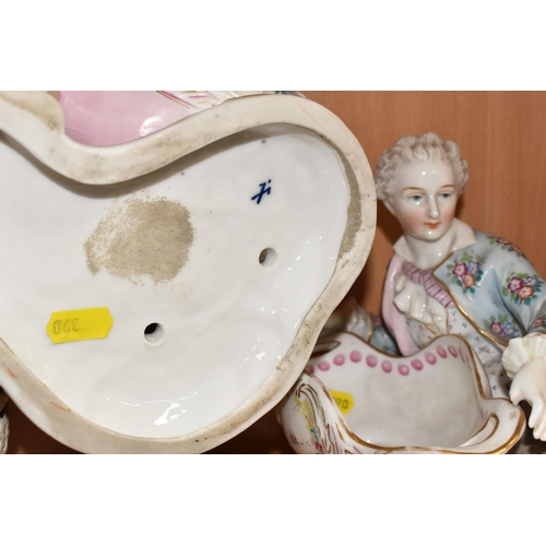 390 - A PAIR OF CONTINENTAL PORCELAIN FIGURAL BON BON DISHES, modelled with a recumbent young gentleman an... 