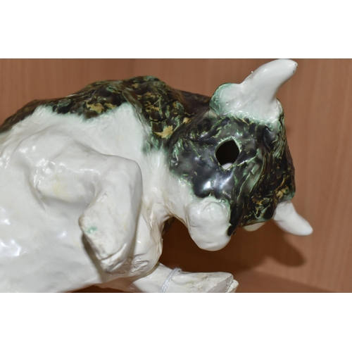 392 - A PAULA HUMPHRIES OF POLPERRO STUDIO POTTERY BULL, decorated with a black, green and white glaze, im... 