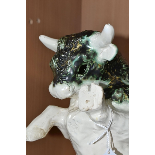 392 - A PAULA HUMPHRIES OF POLPERRO STUDIO POTTERY BULL, decorated with a black, green and white glaze, im... 