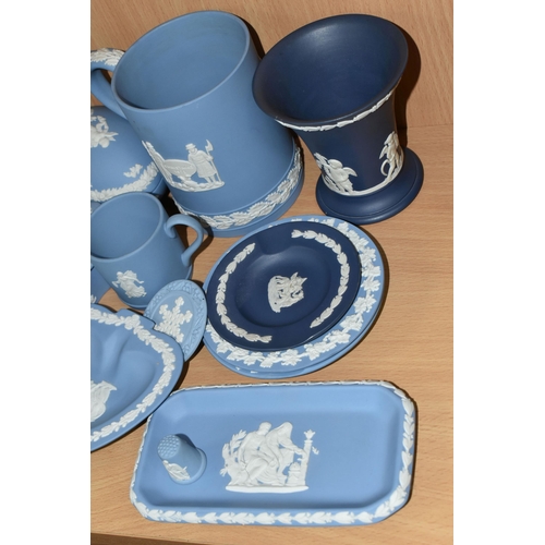 394 - A GROUP OF WEDGWOOD BLUE JASPERWARE, comprising a paper knife, six trinket dishes, a Christmas 1973 ... 