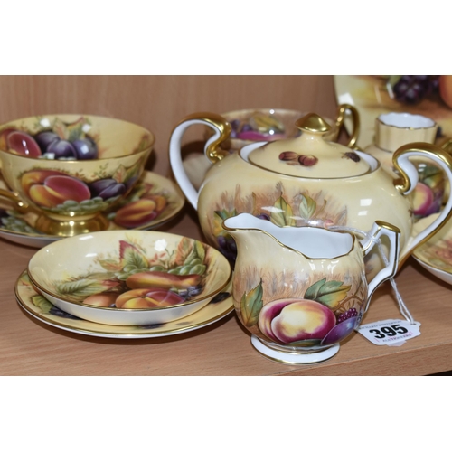 395 - A GROUP OF AYNSLEY 'ORCHARD GOLD' TEAWARE, comprising a twin handled covered sugar bowl with printed... 