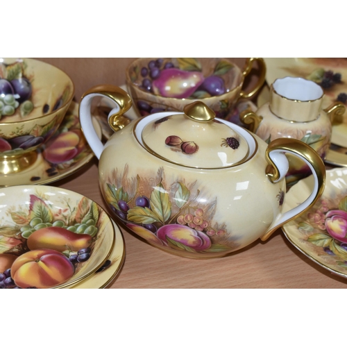 395 - A GROUP OF AYNSLEY 'ORCHARD GOLD' TEAWARE, comprising a twin handled covered sugar bowl with printed... 