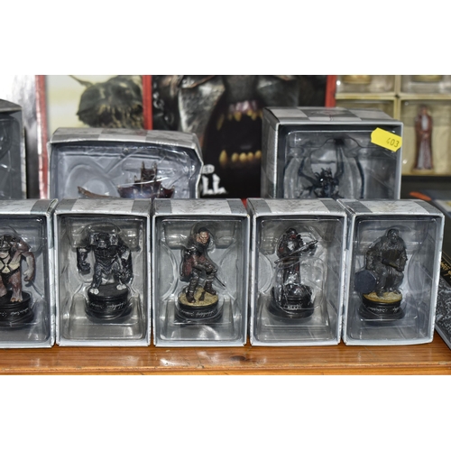 403 - A LARGE COLLECTION OF BOXED EAGLEMOSS 'LORD OF THE RINGS' FINAL BATTLE CHESS FIGURES AND CHESS BOARD... 