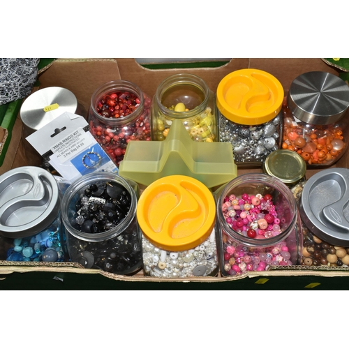 411 - FOUR BOXES OF TEXTILES, FABRIC AND BEADS, to include twenty large glass storage jars of coloured bea... 