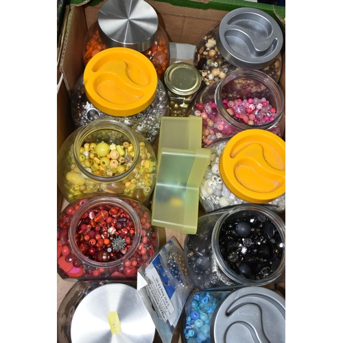 411 - FOUR BOXES OF TEXTILES, FABRIC AND BEADS, to include twenty large glass storage jars of coloured bea... 