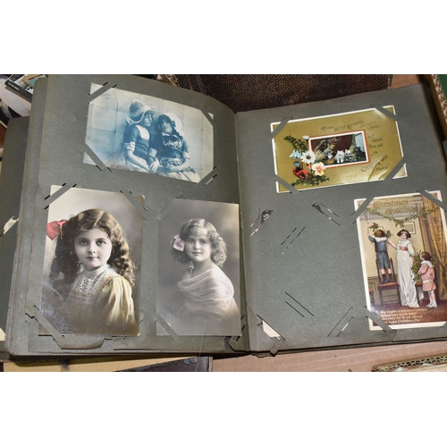 424 - ONE BOX OF PHOTOGRAPHS & POSTCARDS in four albums and loose, the photographs include a holiday in N.... 