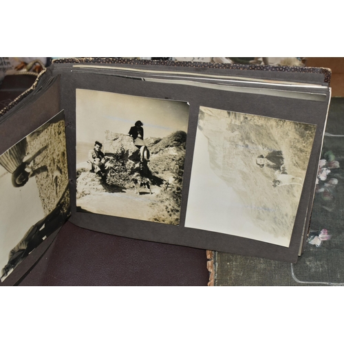 424 - ONE BOX OF PHOTOGRAPHS & POSTCARDS in four albums and loose, the photographs include a holiday in N.... 