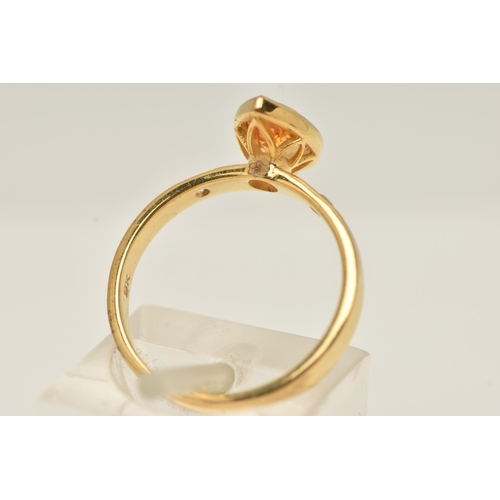 13 - A 9CT GOLD GEM SET RING, an marquise cut orange stone assessed as citrine, bezel set in yellow gold,... 