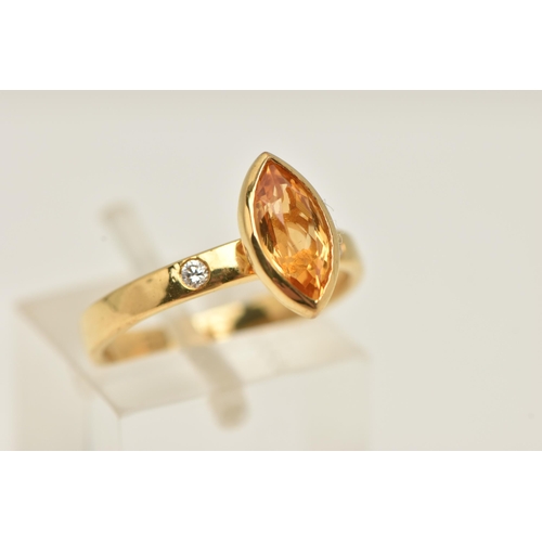 13 - A 9CT GOLD GEM SET RING, an marquise cut orange stone assessed as citrine, bezel set in yellow gold,... 