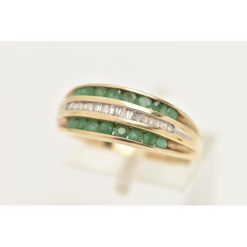 35 - A MODERN 9CT YELLOW GOLD DIAMOND AND EMERALD DRESS RING, designed as a three row ring, the central r... 