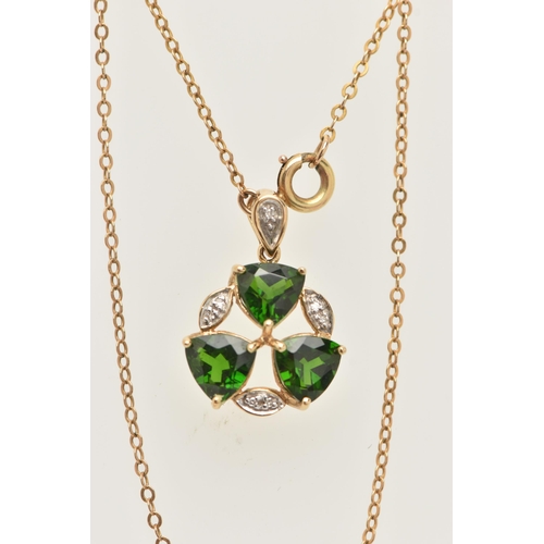 49 - A 9CT YELLOW GOLD TOURMALINE AND DIAMOND PENDANT WITH YELLOW METAL CHAIN, the pendant set with three... 