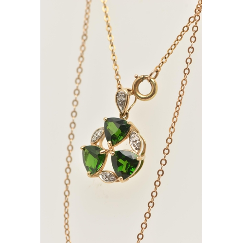 49 - A 9CT YELLOW GOLD TOURMALINE AND DIAMOND PENDANT WITH YELLOW METAL CHAIN, the pendant set with three... 