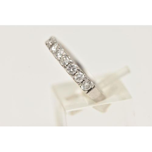 5 - A DIAMOND HALF ETERNITY BAND RING, white metal band ring prong set with eleven round brilliant cut d... 