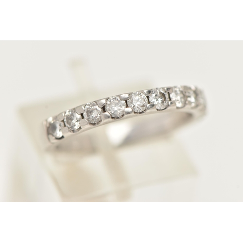 5 - A DIAMOND HALF ETERNITY BAND RING, white metal band ring prong set with eleven round brilliant cut d... 