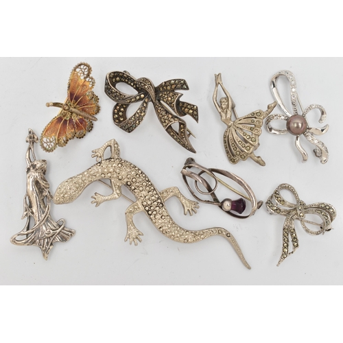 87 - EIGHT BROOCHES, to include a Charles Horner thistle brooch set with a purple paste, fitted with a br... 