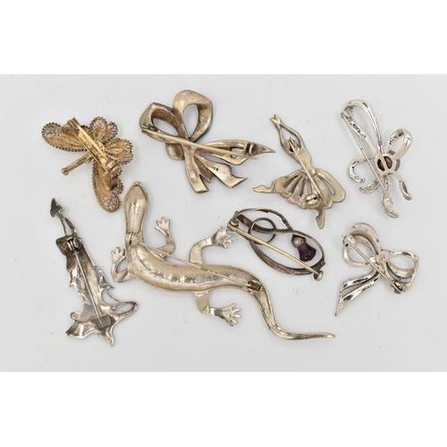 87 - EIGHT BROOCHES, to include a Charles Horner thistle brooch set with a purple paste, fitted with a br... 