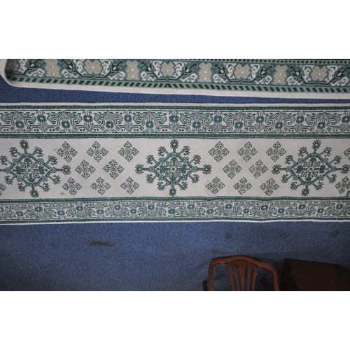 1213 - A RECTANGULAR CREAM AND GREEN WOOLEN RUG, 244cm x 172cm, along with a matching runner (condition rep... 